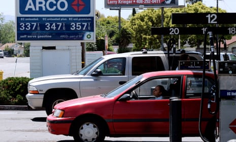 A car and a SUV refilled at an petrol garage in San Jose, California