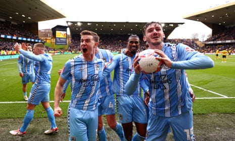 Haji Wright (centre) celebrates with his Coventry City teammates after scoring the winner in the 10th minute of added time.