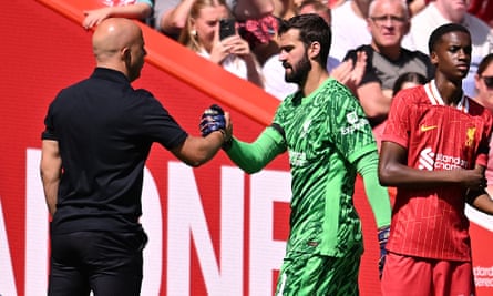 Alisson clasps hands with Arne Slot