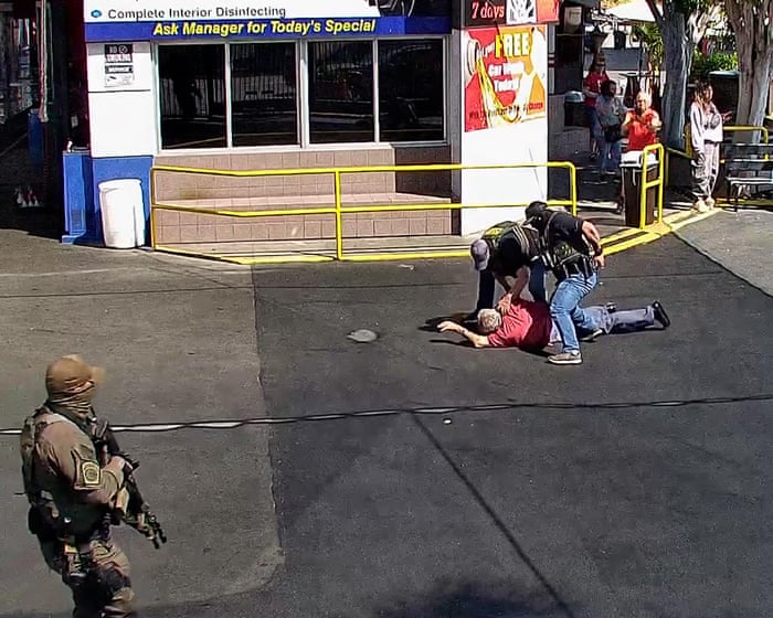 Surveillance footage shows Ice agents pushing 79-year-old man to the ground – video