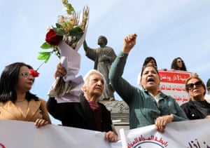 Women chant slogans at a gathering on Al-Mutanabbi street in the city’s historic centre