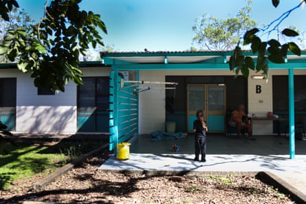 Barak Scambono on the verandah of his evacuation block and his grandson.