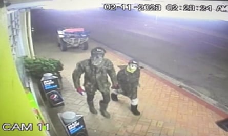 A man thought to be Tom Phillips and one of his children, allegedly attempting to break into a store in Piopio.