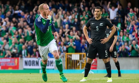 Liam Boyce celebrates his first Northern Ireland goal as New Zealand’s Michael Boxall watches on.