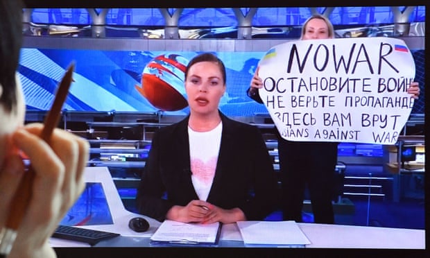 Marina Ovsyannikova (right) protests on Russian live TV in March