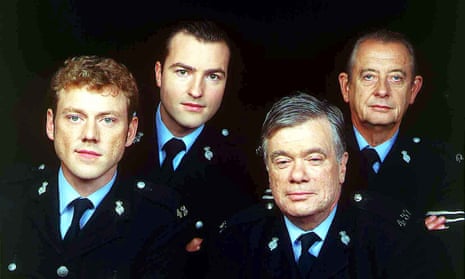 William Simons as PC Alf Ventress, second right, with from left: PC Phil Bellamy (Mark Jordon), PC Nick Rowan (Nick Berry) and Sgt Oscar Blaketon (Derek Fowlds) in Heartbeat, 1995.