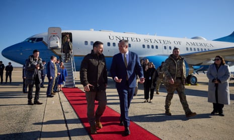 Ukraine's President Volodymyr Zelenskiy walks with Chief of Protocol of the United States Rufus Gifford as he arrives in Washington for talks with U.S. President Joe Biden and an address to a joint meeting of Congress, amid Russia's attack on Ukraine, U.S., December 21, 2022.