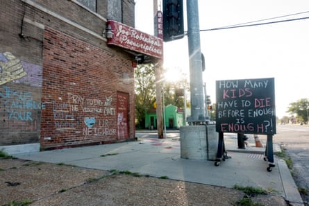 An abandoned building is adorned with chalk art pleading for an end to violence in north St. Louis on Saturday, Sept. 14, 2019. At least 13 children have died of gunshot wounds in St. Louis city this year, and six children in St. Louis Country have been killed by gunfire.
