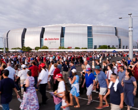 a large group of people standing outside stadium