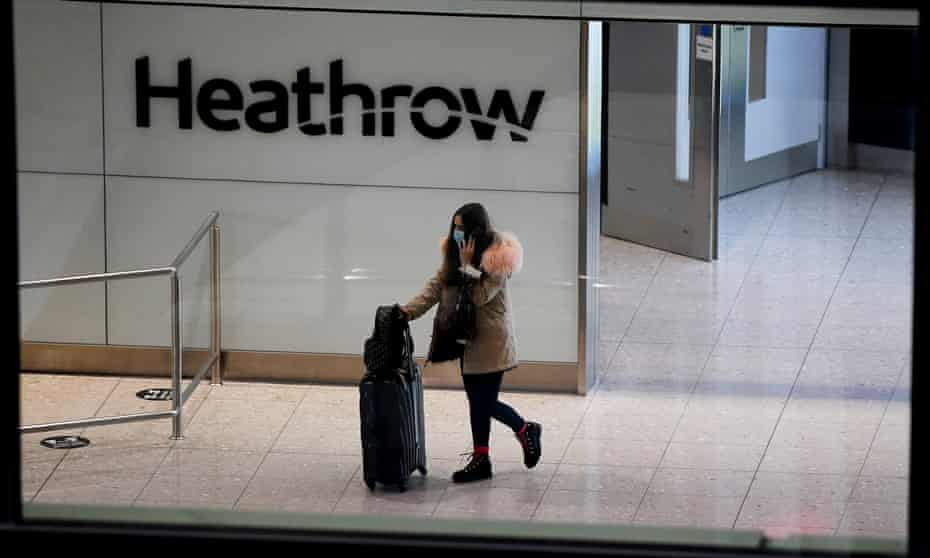 A traveller arrives at Heathrow airport, London.