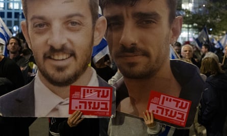 Pictures of David (left) and Ariel Cunio at a protest calling for the release of hostages