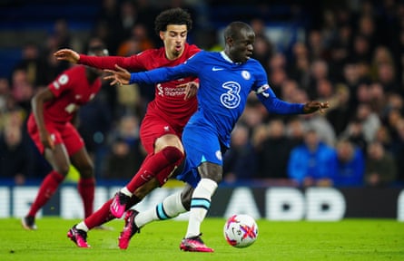 Curtis Jones of Liverpool chases Ngolo Kante of Chelsea