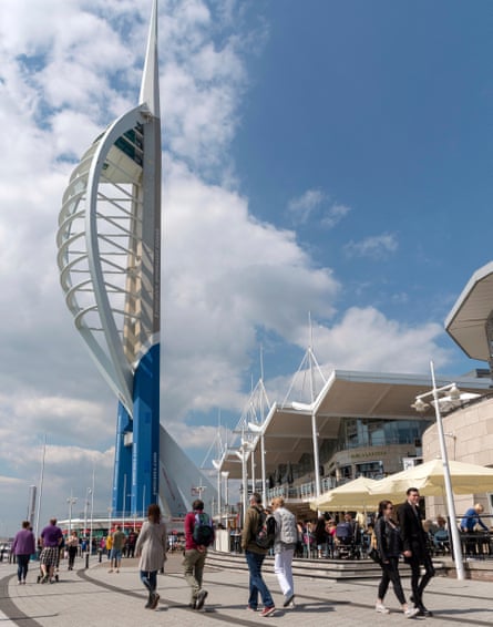 People walking around Spinnaker Tower in Portsmouth.