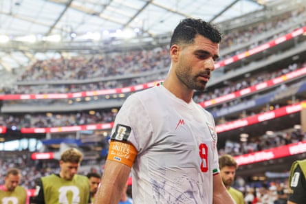 Iran captain Mehdi Taremi walks off during halftime
