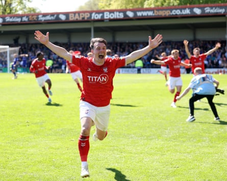 Ryan Fallowfield of York celebrates after teammate Josh Stones scored against Rochdale