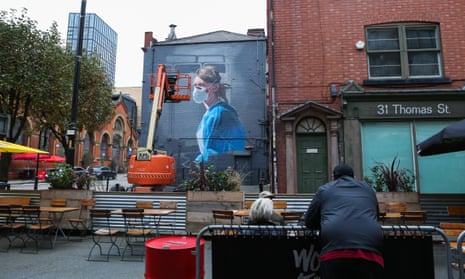 A new mural in Manchester depicts an NHS worker, seen from a bar in the Northern Quarter.