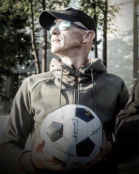 Orlov in sunglasses holds a football