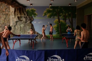 Pyongyang residents play table tennis at Munsu Water Park