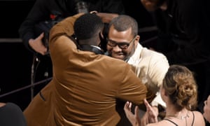 Daniel Kaluuya, left, congratulates Jordan Peele, winner of the Oscar for best original screenplay.