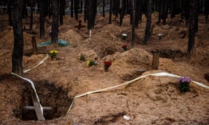 empty graves after the exhumation of bodies in the mass grave created during the Russian's occupation in the town of Izyum, Kharkiv region, amid the Russian invasion of Ukraine