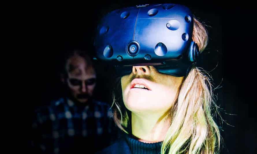 a woman wearing a headset for immersive theatre piece virtually dead