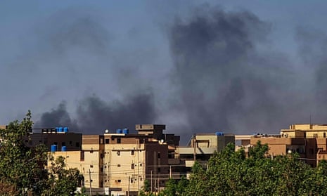 Smoke billows above buildings in southern Khartoum