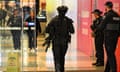 Heavily armed police search a shopping centre in Adelaide