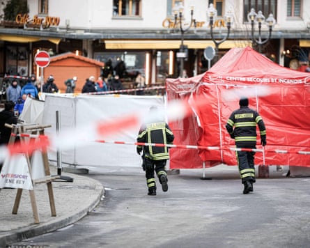 Officials and tents near the scene of the fire