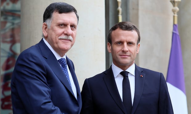 Fayez al-Sarraj (L) meets Emmanuel Macron in Paris