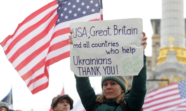Woman holds poster thanking US and Britain for support