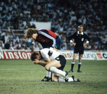 Uli Stielike is comforted by Harald Schumacher after having his spot kick saved by Jean-Luc Ettori.
