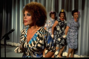 Jazz and pop singer Cleo Laine performing on set with a trio of backing singers in drag, likely on the set of variety programme Bonkers, circa 1979