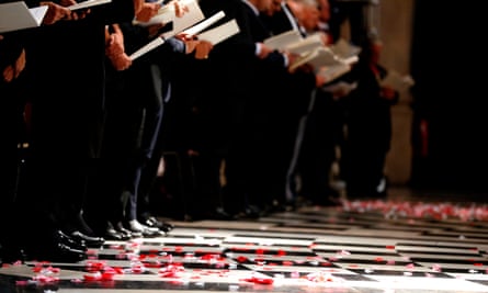 Poppy petals lie on the floor during the service at St Paul’s Cathedral.