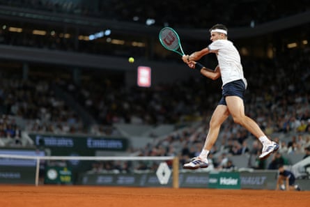 Czech Republic's Jakub Mensik plays a backhand return to Brazil's João Fonseca during their men's quarter final