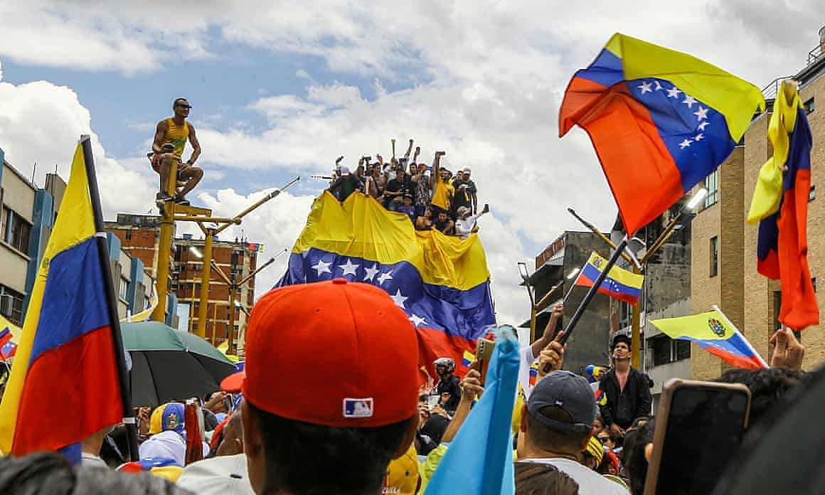 Venezuelan opposition supporters wave flags