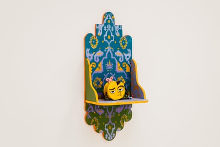 A cartoon cheese wheel sat on a Hindu plinth.
