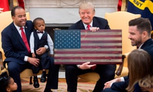 Donald Trump holds an American flag made of wood. 4978.jpg?width=300&quality=85&auto=forma