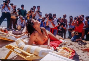 Jasmine, Carlton Beach, 1988Prior to social media many aspiring actors and models headed to Cannes in the hope of getting their photo taken and becoming famous. It was a trend kickstarted by Brigitte Bardot who in 1953 posed in a tropical printed bikini to promote the film Manina, the Girl in the Bikini. The resulting photos became front page news. Ridgers noticed that photographers would roam the beach asking women to pose for them. Here he captures a woman called Jasmine who, previous to the crowd descending, was quietly sunbathing.