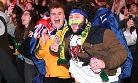 Australian fans celebrate in Melbourne after Australia’s victory over Denmark (Photo by William West/AFP via Getty Images)