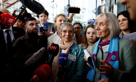 Women from the KlimaSeniorinnen group speak to reporters