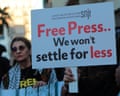 Protesters holding a banner that reads: 'Free press ... we won't settle for less'.