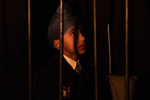 A child wearing a turban stands close to the Eternal Flame at the Shrine of Remembrance in Melbourne.