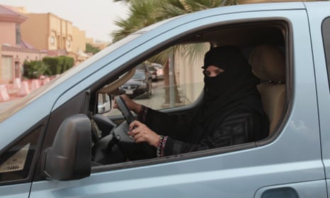 A woman drives a car in Riyadh, Saudi Arabia
