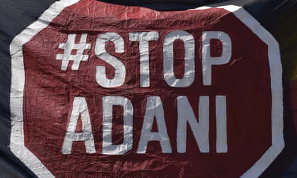 An anti-Adani protest sign