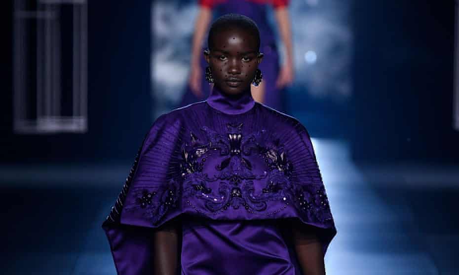 A model wears a Vatican-purple mini cape on the Fendi catwalk in Paris.