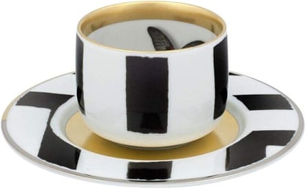a black and white cup and saucer