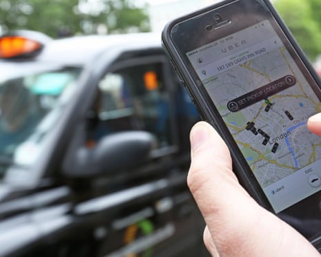 London Taxis Plan 10,000 Car Protest in June Over Uber App<br>A user scans for an available vehicle using the Uber Technologies Inc.'s app on an Apple Inc. iPhone 5 smartphone in this arranged photograph in London, U.K., on Friday, May 30, 2014. London's taxis are planning a 10,000-cab protest next month, as professional drivers across Europe demonstrate growing opposition to the Uber app. Photographer: Chris Ratcliffe/Bloomberg via Getty Images