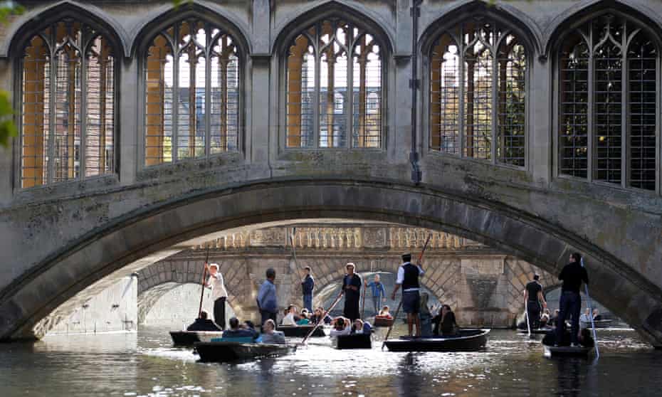 People are seen punting on the River Cam near the Bridge of Sighs at St John’s College in Cambridge