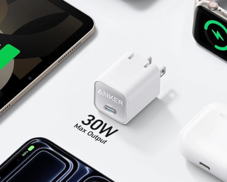 usb charger next to tablet, smartwatch phone and earbuds