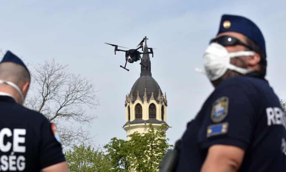 Police officers in Szolnok, Hungary, use a drone to find residents failing to comply with the stay-at-home order